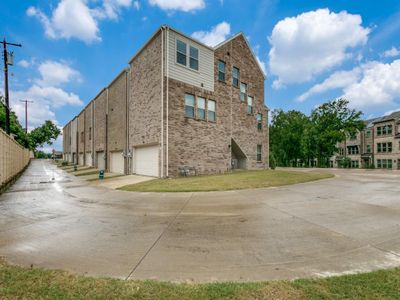 View of building exterior featuring a garage | Image 3