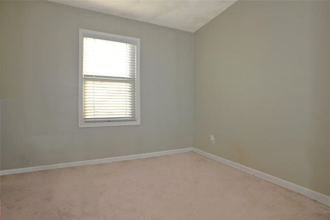Office featuring light colored carpet | Image 19