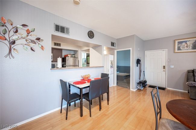 Dining room featuring light wood-style floors, visible vents, and baseboards | Image 11