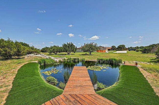 Dock area featuring a water view and a yard | Image 37
