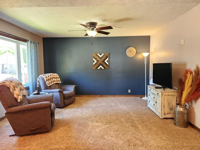 Living room features new picture window with side lights. | Image 9