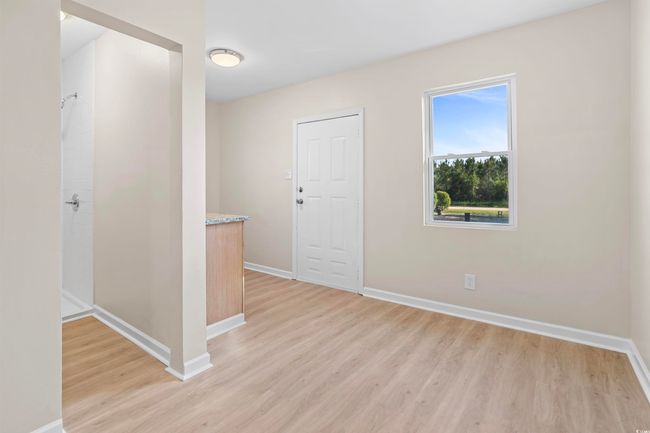 Spare room featuring light wood finished floors and baseboards | Image 37
