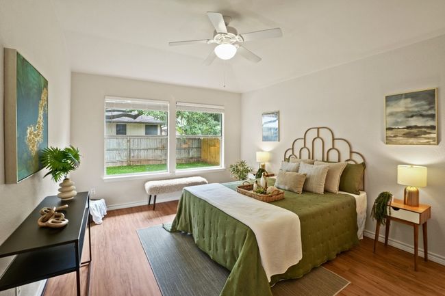 Spacious primary bedroom with natural light and clean, no-carpet flooring. 9349 Bernoulli Dr., Austin, TX 78748 | Image 15