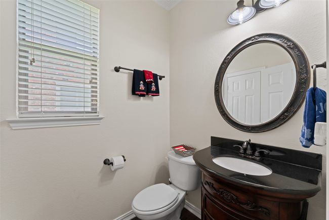 Bathroom featuring vanity and toilet | Image 34