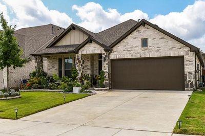 View of front of property with a garage and a front lawn | Image 1