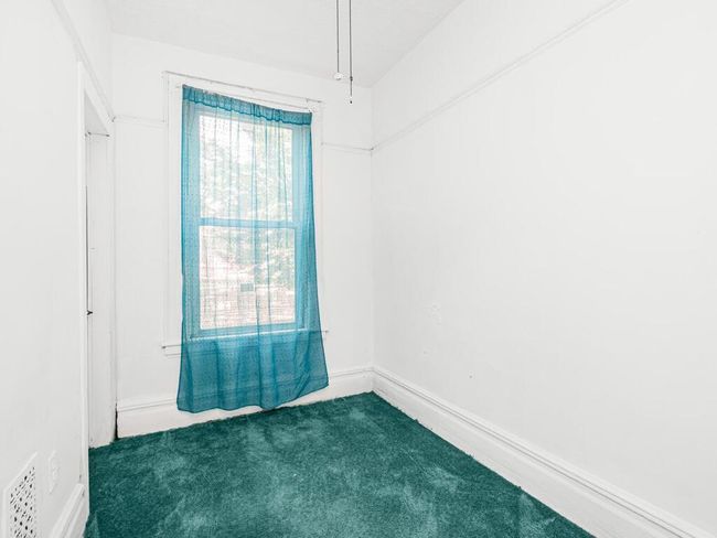 Carpeted empty room with visible vents | Image 15