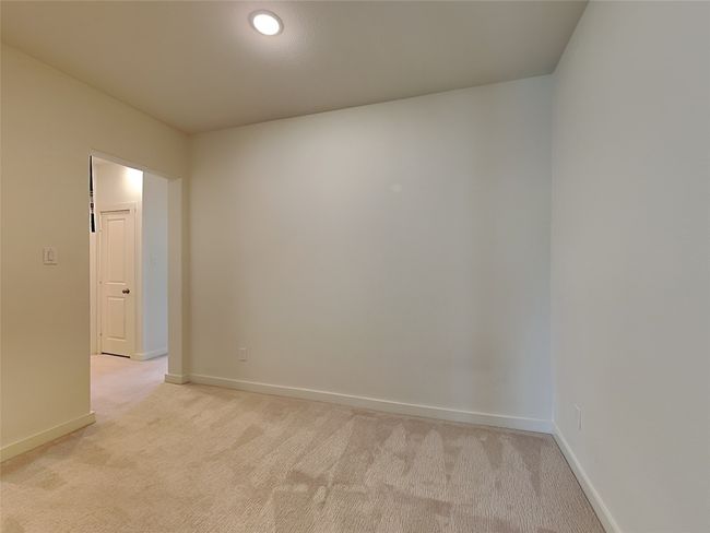 Spare room featuring light colored carpet and baseboards | Image 13