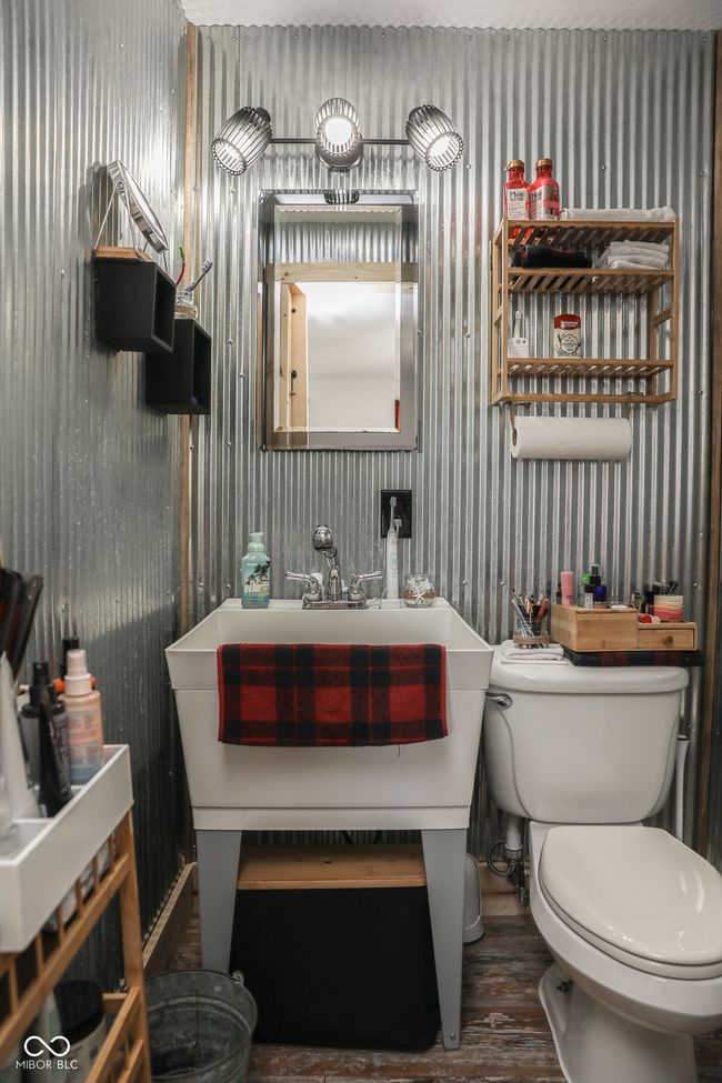 half bath featuring wallpapered walls, toilet, and wood finished floors | Image 14