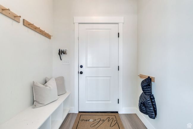 Mudroom with baseboards and wood finished floors | Image 22