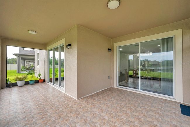 large, screened patio with water view | Image 56