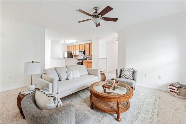 The condo features an open concept layout. | Image 5
