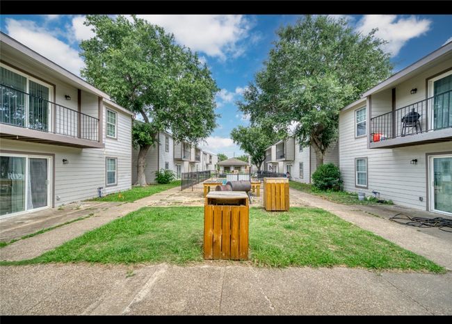 View of community featuring a yard and a residential view | Image 9