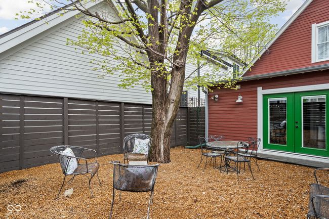 exterior space with fence and french doors | Image 29