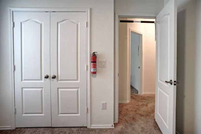 Hall featuring carpet flooring and baseboards | Image 25