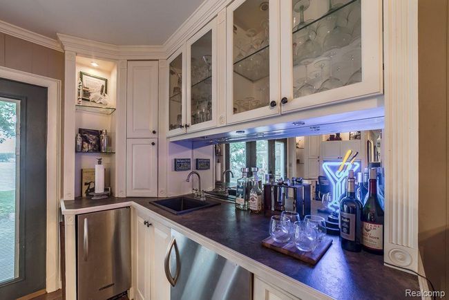 Wet bar w/ fridge & under mount lighting | Image 25