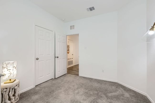 Unfurnished bedroom with carpet flooring and baseboards | Image 22