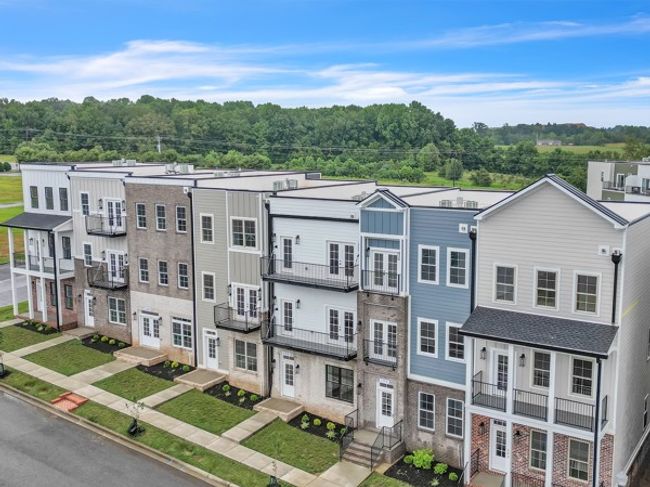 A beautiful shot of the 7 town home units each with its own unique design & features! Notice the sidewalks that run through out Pleasant View Village. | Image 36
