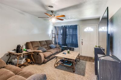 Living room featuring wood-type flooring and ceiling fan | Image 3