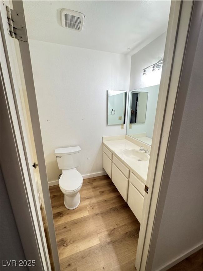 Bathroom featuring vanity and wood finished floors | Image 35