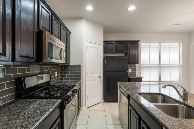Another view of gourmet kitchen. | Image 19