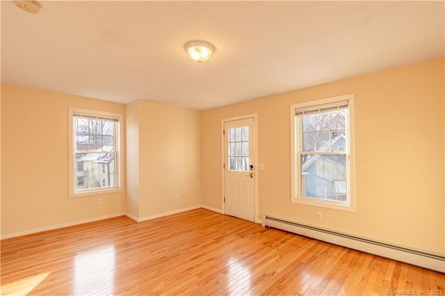 Living room with hardwood floors and plenty of natural light | Image 10