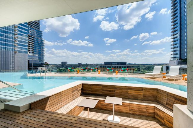 View of swimming pool featuring a view of city | Image 29