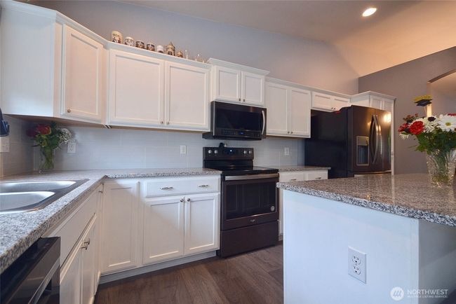Another view of the Kitchen and island. | Image 11