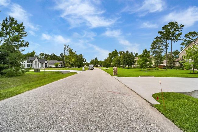 Build your dream home on this stunning wooded lot, where possibilities abound—whether you envision a timeless traditional design or a sleek modern retreat. Located in the prestigious Bender’s Landing Estates, this property offers more than just beautiful surroundings. | Image 9