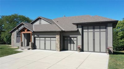 View of front facade with a garage | Image 2