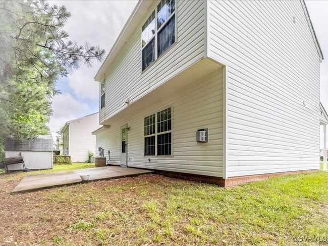 Back of house featuring a patio, a yard, and a storage shed | Image 26