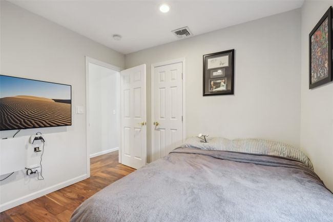 Bedroom with recessed lighting, visible vents, baseboards, and wood finished floors | Image 25