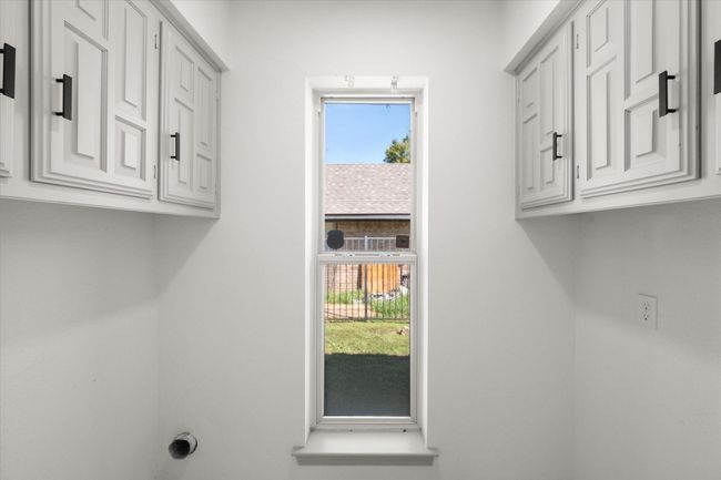 Laundry room includes built in cabinets for extra storage! | Image 34