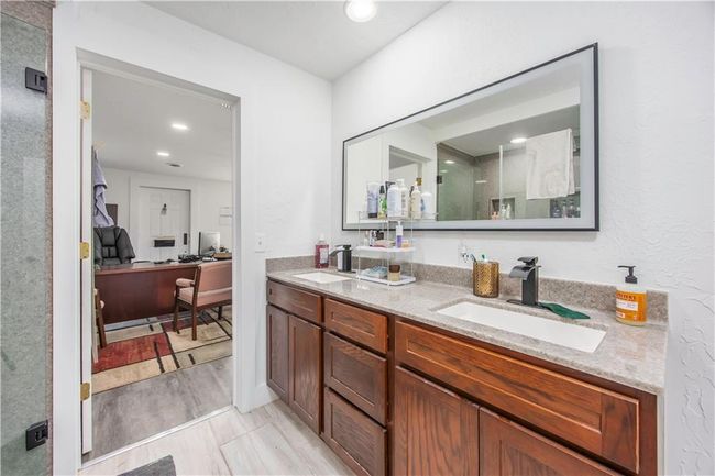 Full bathroom with double vanity, recessed lighting, and a sink | Image 14