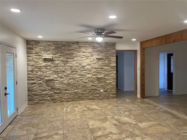 Open to kitchen, ceiling fan, and recessed lighting | Image 7