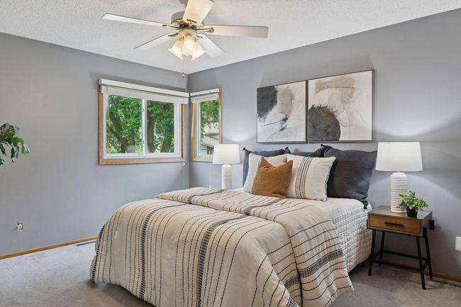 Primamry bedroom with ceiling fan and custom closet. | Image 18