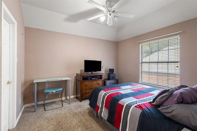 Upstairs bedroom with window facing to the side of the home. | Image 21