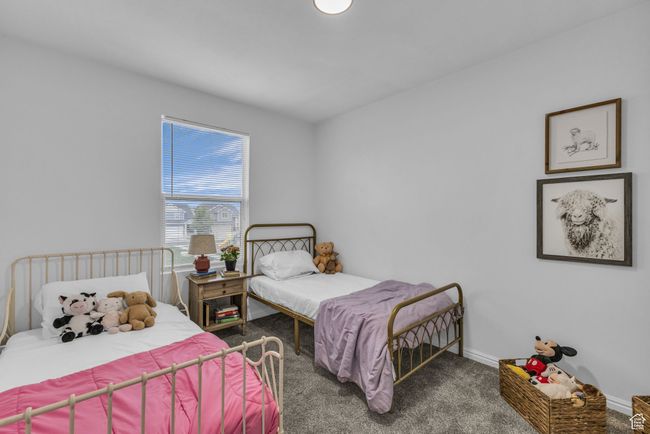 Carpeted bedroom with baseboards | Image 19