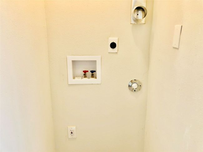 Laundry area featuring washer hookup and hookup for an electric dryer | Image 14