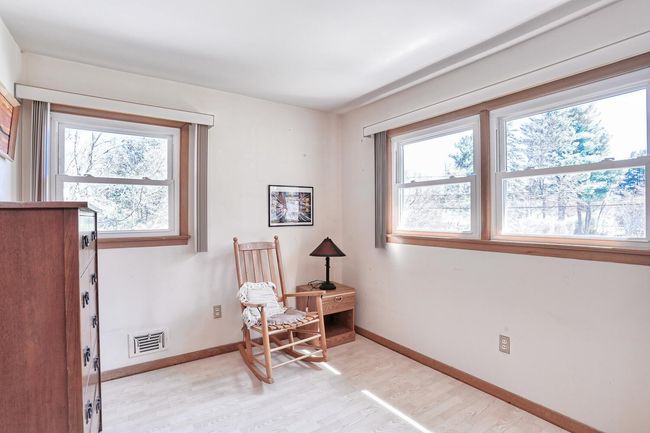 Sitting room featuring baseboards, visible vents, and light wood-type flooring | Image 19