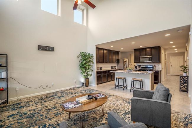 The living room is large and offers a great family relaxing area. | Image 20