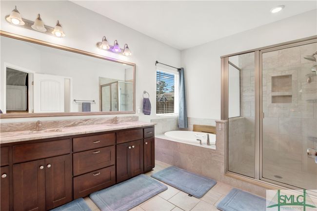 Owner bath with double sinks, large soaking tub and separate tile shower | Image 20
