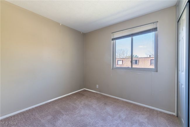 Carpeted empty room with baseboards | Image 15