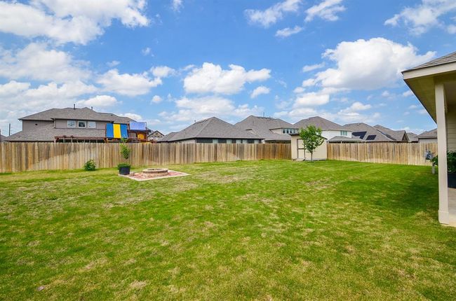 The entire back property is surrounded by privacy fencing. | Image 28
