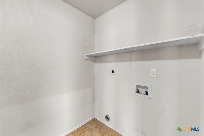 Dedicated Laundry Room with Shelving | Image 23