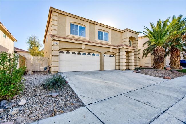 View of front of property featuring concrete driveway, an attached garage, fence, and stucco siding | Image 42