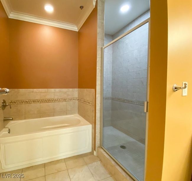 Full bath with a garden tub, tile patterned floors, ornamental molding, and a stall shower | Image 18