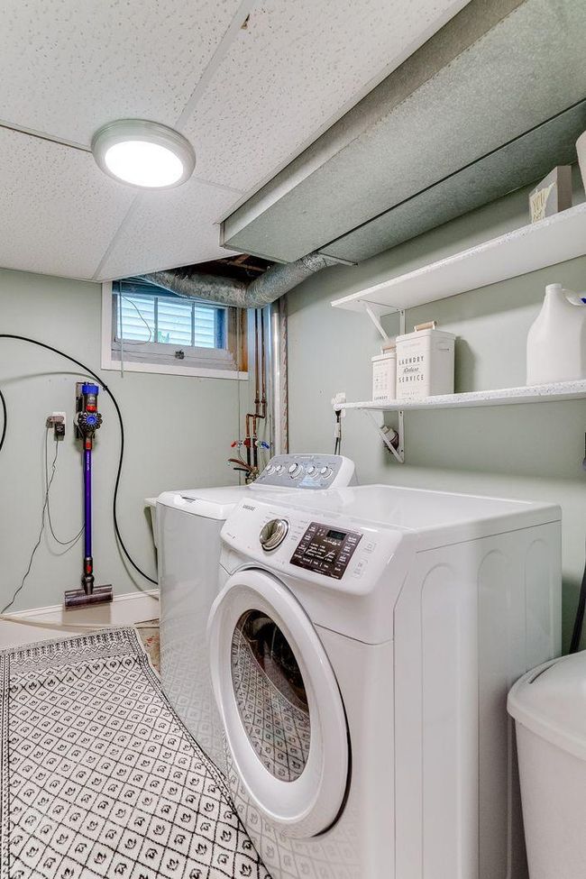 Finished laundry space with utility sink | Image 27