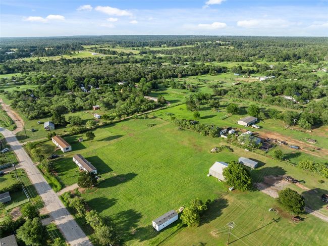 Aerial view of property's location with a forest | Image 15