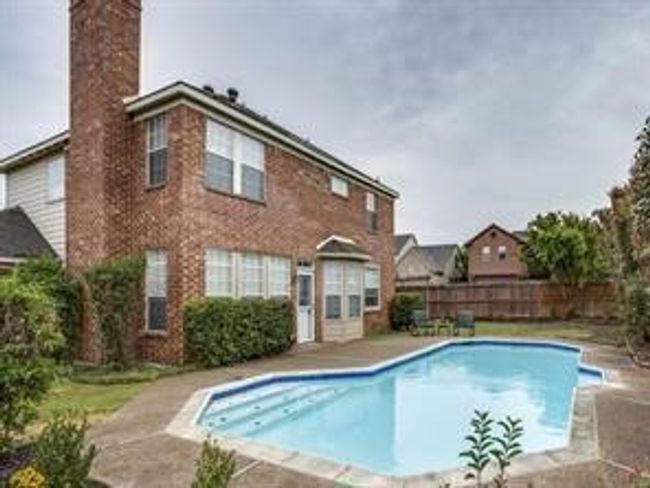 View of pool featuring a fenced backyard and a patio area | Image 16