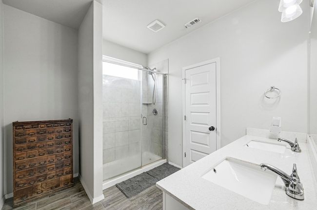 Two walk in closets in the primary bedroom for your storage needs. | Image 17